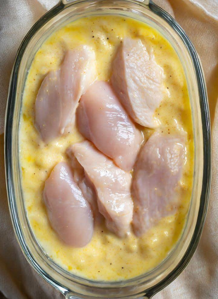 Mom puts raw chicken on a creamy casserole mixture and serves up a tasty dinner in a flash.