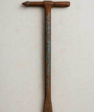 Found a metal bar on my driveway. Any idea what it could be?