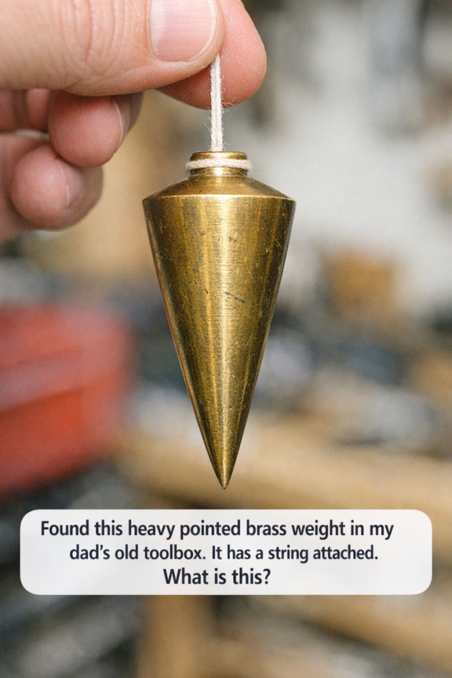 Found this heavy pointed brass weight in my dad’s old toolbox. It has a string attached. What is this?